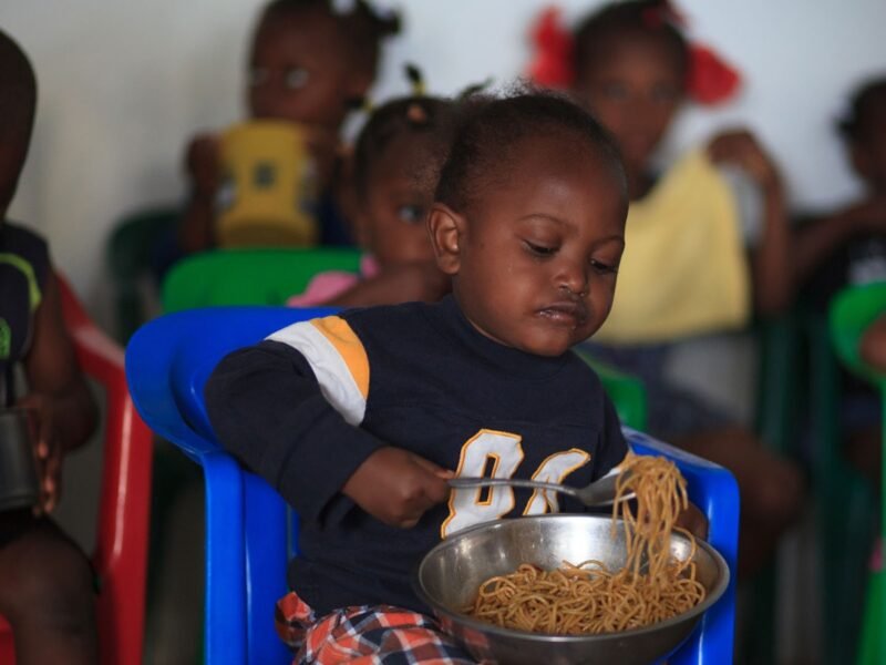 A toddler enjoying a meal